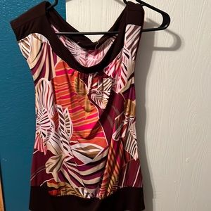 Blouse is in like new condition.Size large. Tags are missing